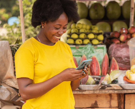 woman holding a phone and smiling